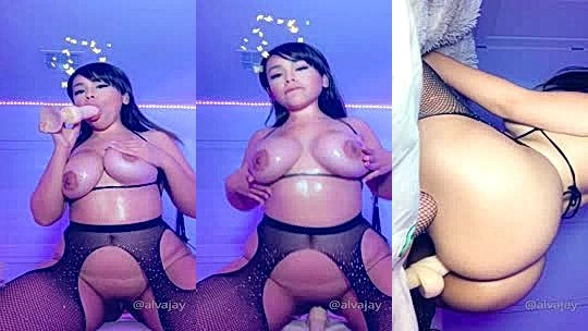 Alva Jay riding a big dildo in fishnet leggings